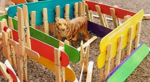 clothespins, popsicle sticks and plastic figurines