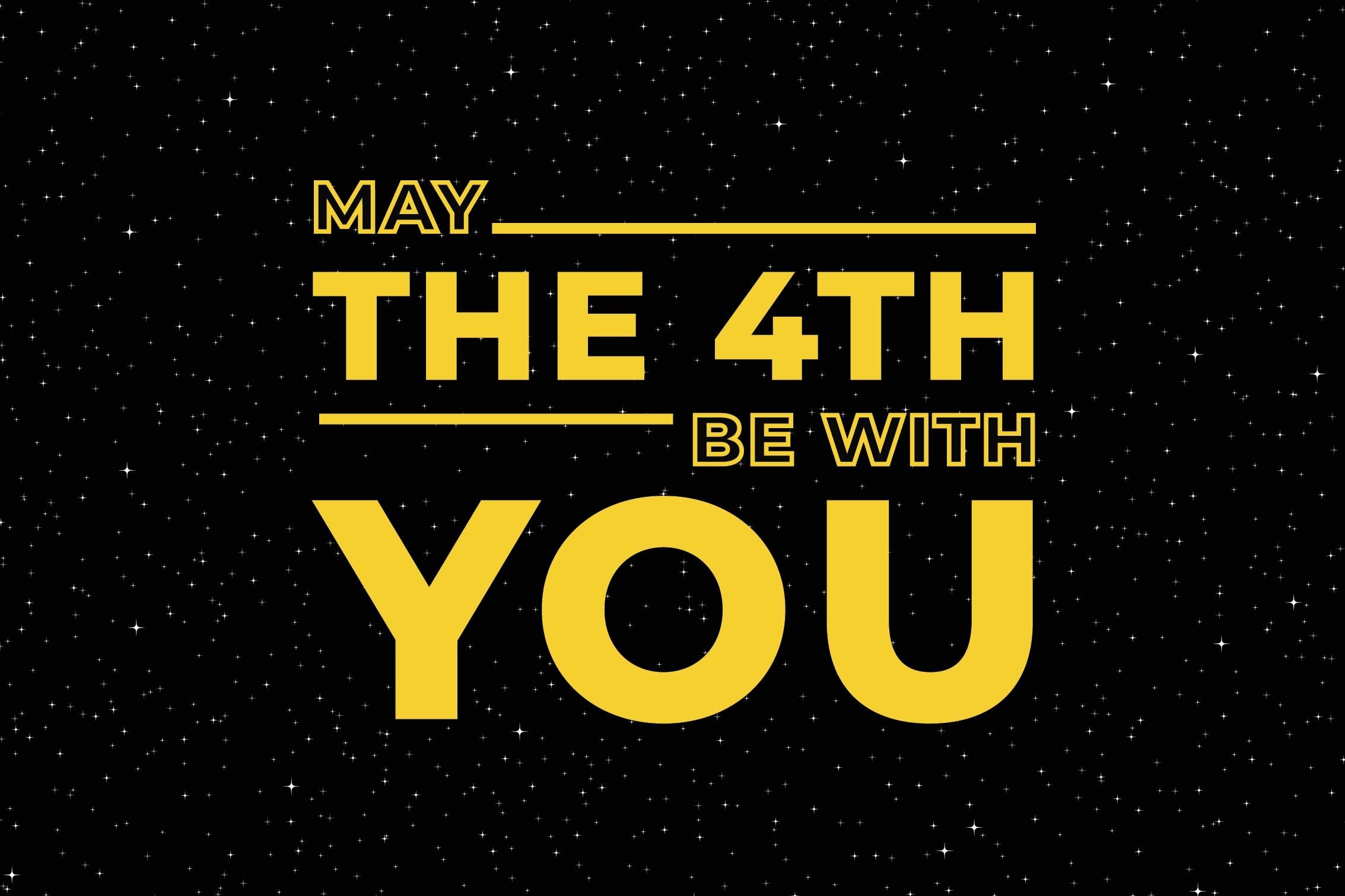 Gold text against a black background that read May the 4th Be With You.
