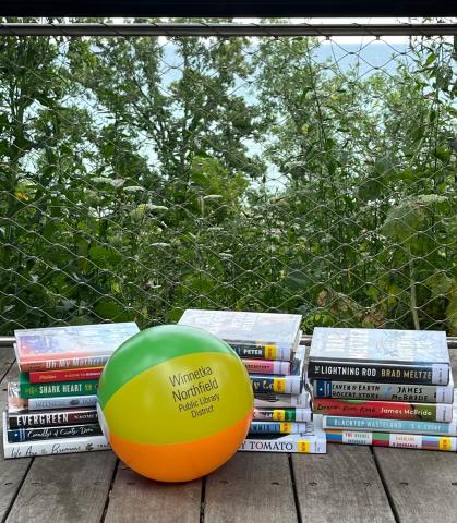 Books and beach ball displayed on the beach overlook