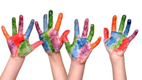 four hands with multicolored paint on them