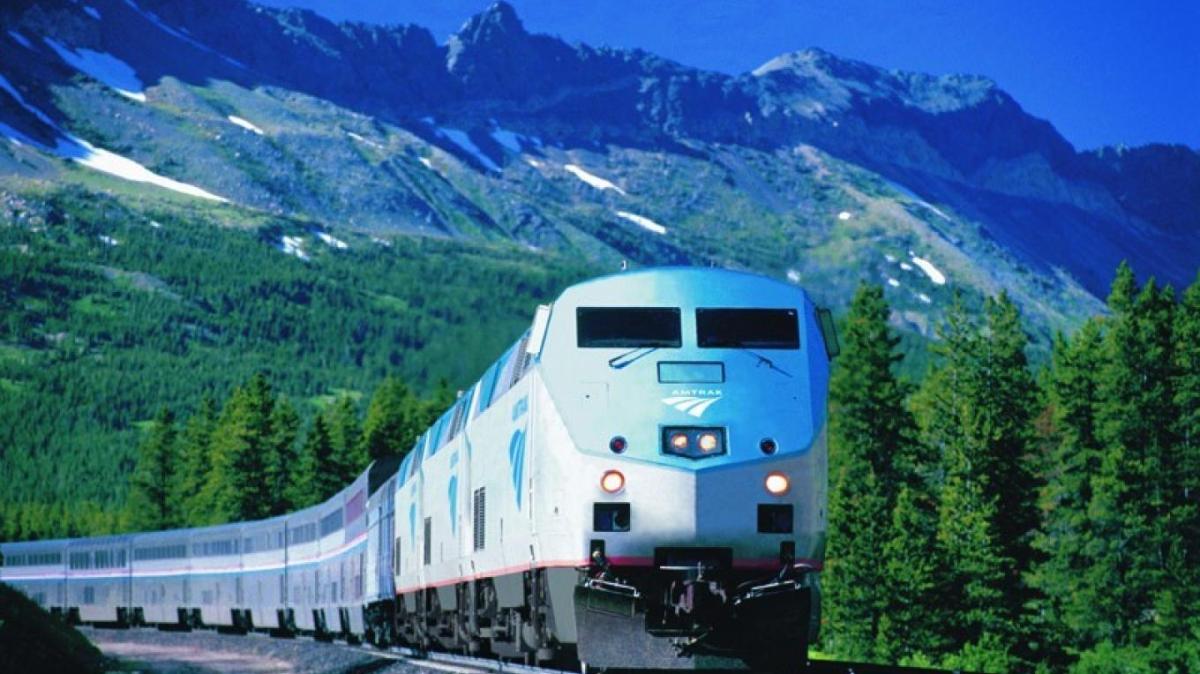 Amtrak train traveling through mountains