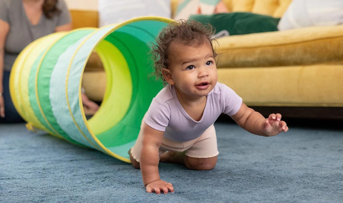 baby crawling out of pop-up tunnel