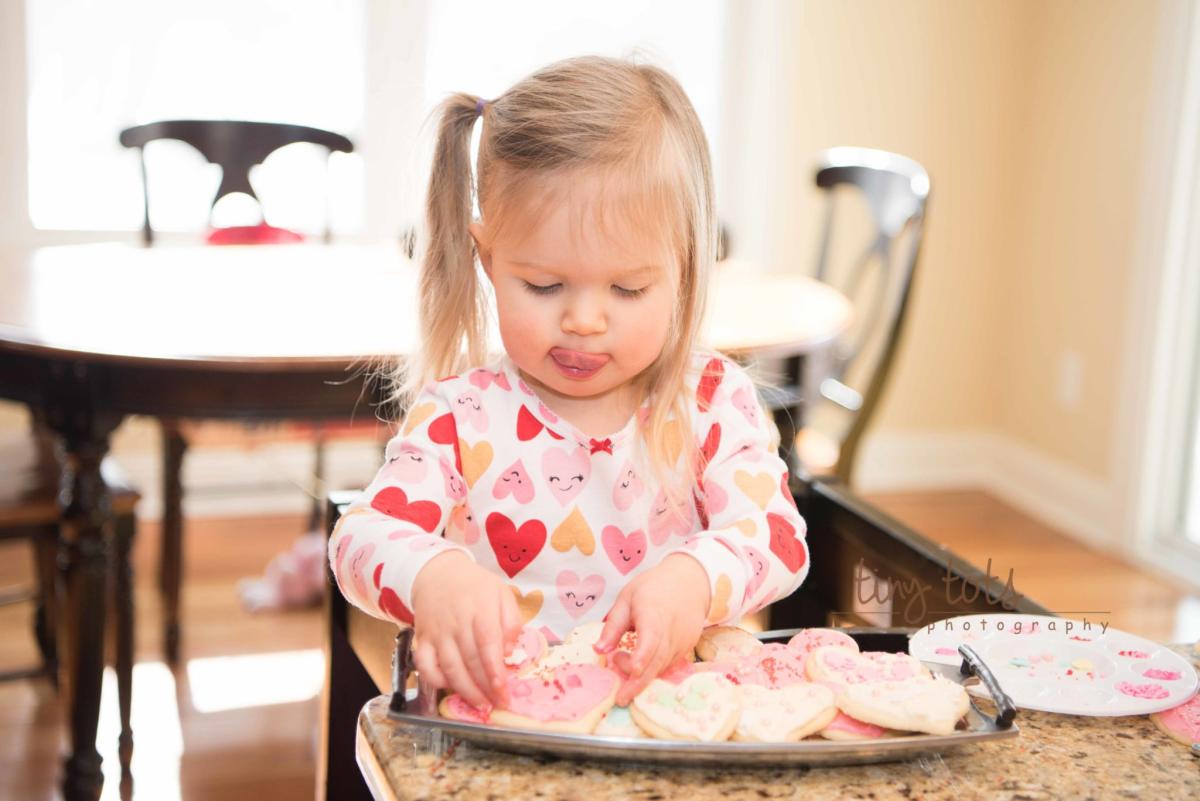 girl decorating cookie